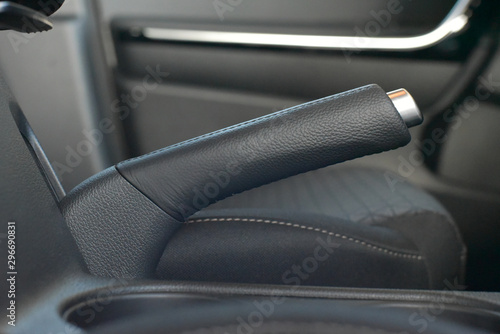 Manual brake in interior of modern car close