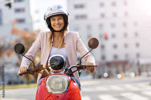 Woman Riding Scooter In The City