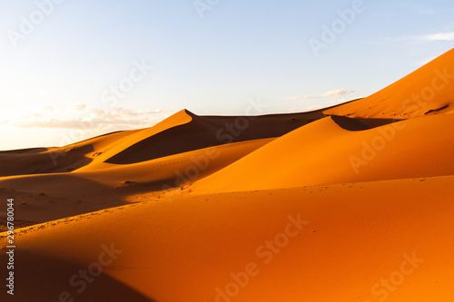 Scenic view of dunes with footsteps in Sahara desert against sky