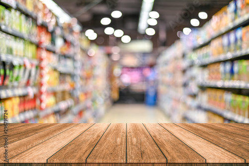 Empty top wooden table with supermarket blur background