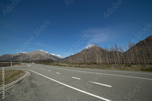 Beautiful scenic route witrh snowcap mountain and green field in Arthur's Pass,New Zealand.