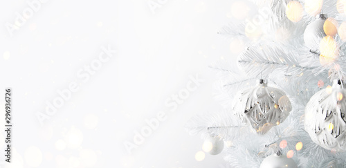 Decorated white ornaments Christmas tree on white background. Merry Christmas and Happy Holidays greeting card, frame, banner. New Year.