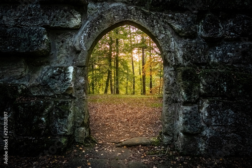 archway with autumn forest behind