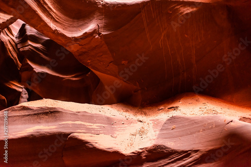 Abstract closeup view of sand on rocks with shadows and light at upper Antelope slot canyon sandstone in Page, Arizona