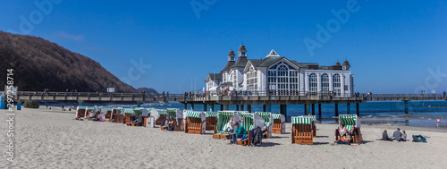 Panorama of beach chairs in front of the sea bridge in Sellin, Germany