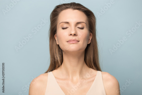 Calm millennial woman relax breathing fresh air