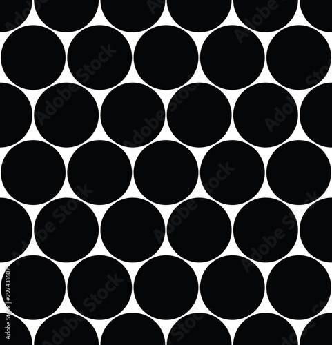 Seamless polka dot pattern in triangular arrangement. Black dots on white background. Vector illustration