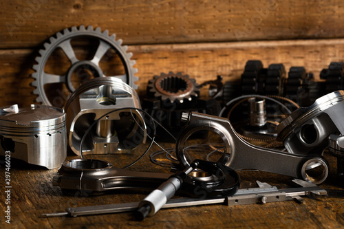 motorcycle engine parts on a workbench with some tools