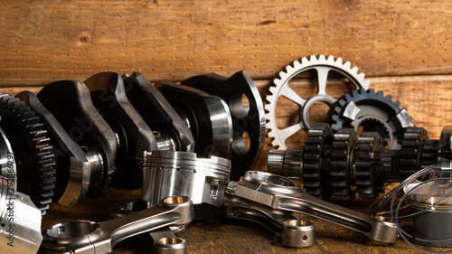 motorcycle engine parts on a workbench with some tools