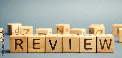 Wooden blocks with the word Review. Customer review concept. Reviewing, auditing, reviewer. Service rating. Feedback.