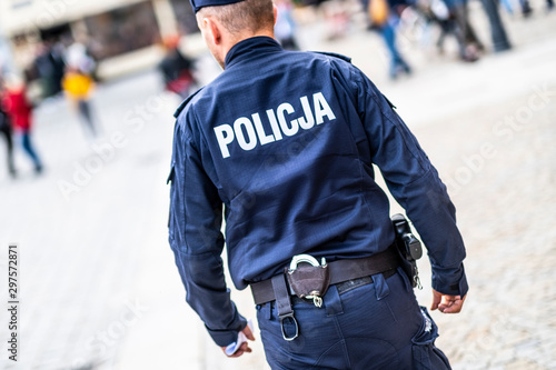 Wroclaw, Poland-ocobert/19/2019 The policeman on the street on duty. Close up of police logo.