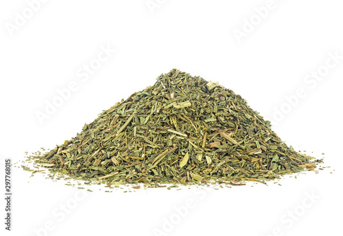 Pile of dried chopped tarragon on a white background. Estragon. Artemisia dracunculus.