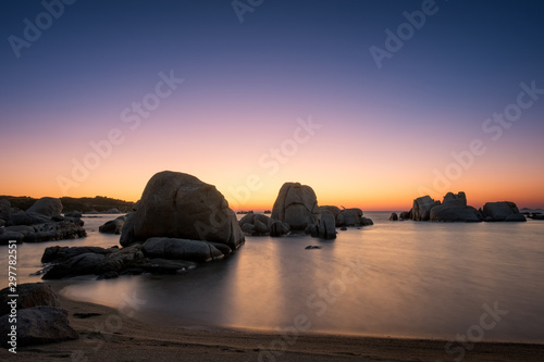 Sunrise over boulders at Cavallo Island in Corsica