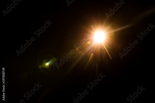 abstract lens flare red light over black background