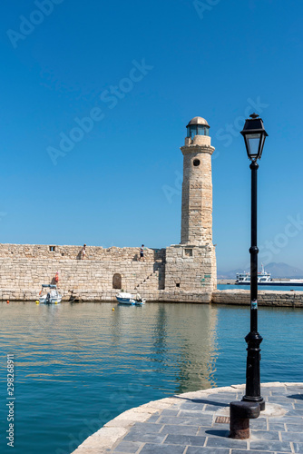 Rethymno, Crete, Greece. October 2019. The ancient lighthouse on the old historic Venetion Harbour at Rethymno, Crete.