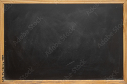 Abstract texture of chalk rubbed out on blackboard or chalkboard background, can be use as concept for school education, dark wall backdrop , design template , etc.
