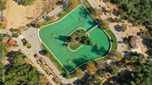 Aerial drone photo of famous Park of Filadelfia with small square pond, Athens, Attica, Greece