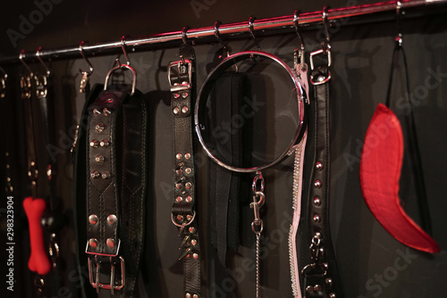 Whips for BDSM on a dark background. Accessory for sexual games.