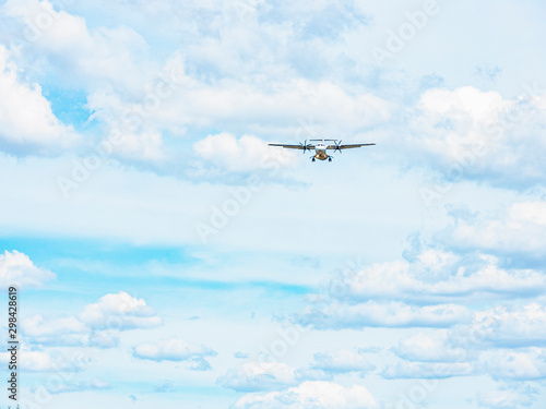 A commercial passenger airplane coming in for landing at Canberra airport, Australia on a sunny afternoon 