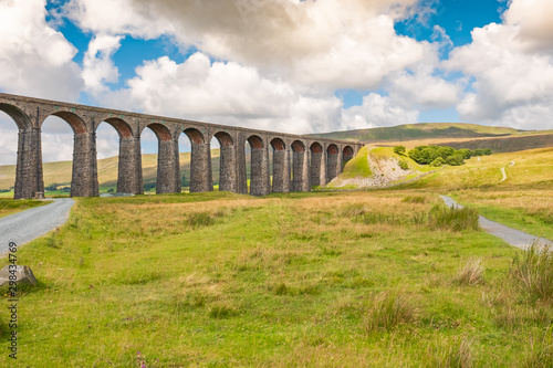 Famous Ribble Valley viaduct railway crossing seen in all its glory. Set in the heart of the Dales, a number of paths can be seen.