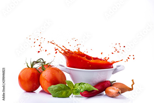 ingredients with vegetables, and tomato puree, with a splash