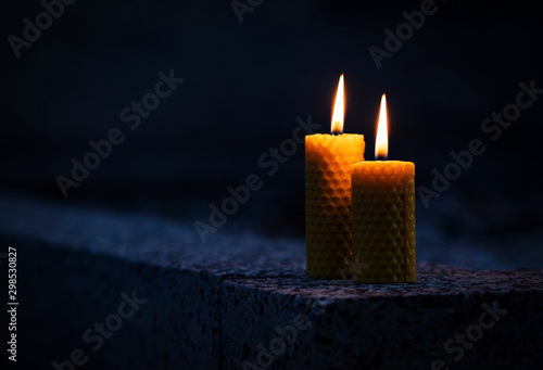 Two candles with beeswax on the monument