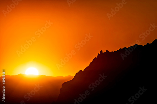 Sunset in the Mountains with Silhouetted Peak 