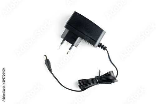 a ac dc black power adapter isolated on white background. view from above.