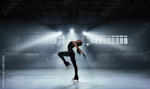 Figure skating girl in ice arena.