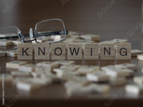 The concept of Knowing represented by wooden letter tiles