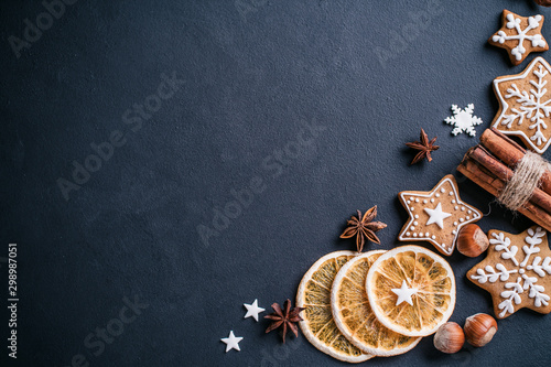 Christmas and New Year composition. Festive decorations and homemade gingerbread with copy space for text design. Holiday and celebration concept, greeting card or invitation mockup
