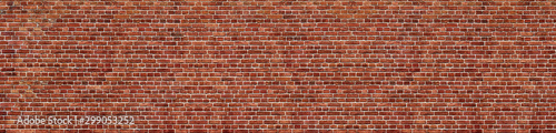 Old red brick wall background, wide panorama of masonry