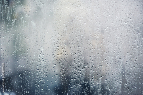 Rainy background, rain drops on the window, autumn season backdrop, abstract textured wallpaper