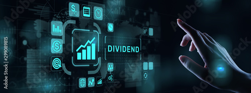 Dividends button on virtual screen. Return on Investment ROI financial business wealth concept.