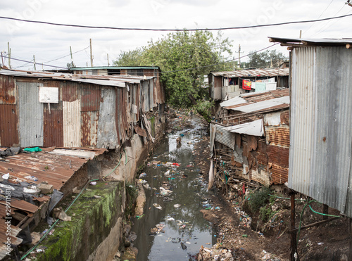 Polluted water flows through the Kibera slum in Africa.