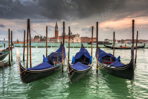 San Giorgio Maggiore Church with venetian boats at the harbor, Venice. Italy