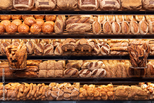 Bakery shelf with many types of bread. Tasty german bread loaves on the shelves