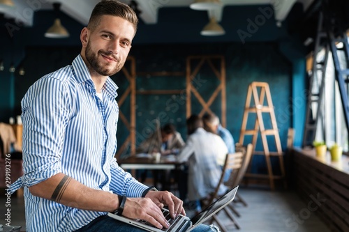 Man Working At Laptop In Contemporary Office