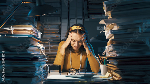 Exhausted businesswoman in her office