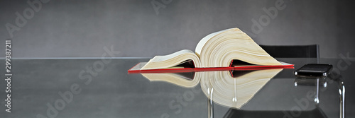 German Law, Book and Smartphone on Glass Table