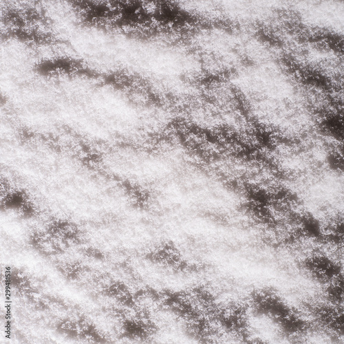 Texture and background of night snow. Top view. Winter. Copy space. Instagram style
