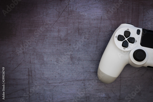 Video games white gaming controller isolated on dark moody background top view