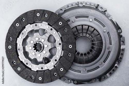 Close-up picture of a part of car, black clutch disk isolated on white background