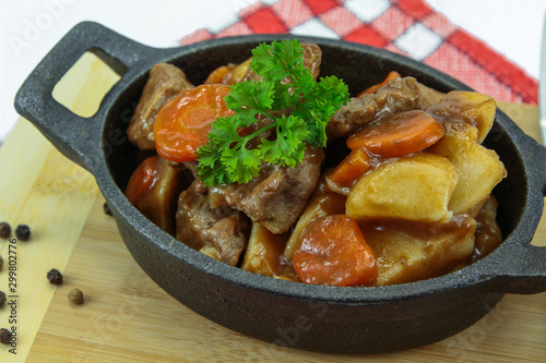plate of beef bourguignon and potato