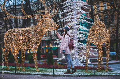 Christmas decorations in the historical center streets of Helsinki, with evening light illumination, concept of Christmas in Finland, with Cathedral, market square, christmas tree