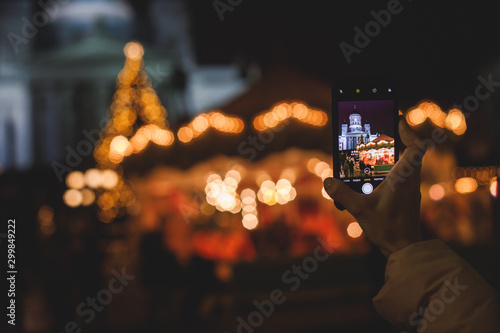 Christmas decorations in the historical center streets of Helsinki, with evening light illumination, concept of Christmas in Finland, with Cathedral, market square, christmas tree