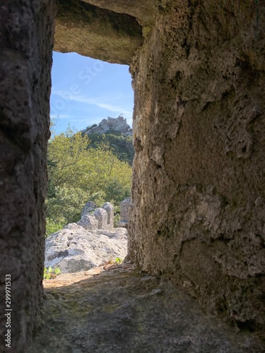 medieval window overlooking the sky and the castle