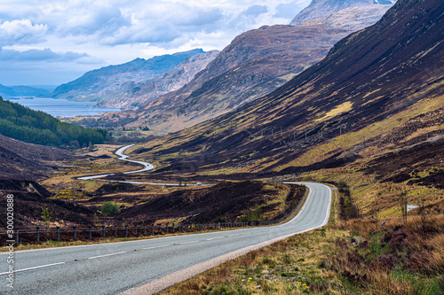 driving road scotland lake mountains sky dramatic landscape