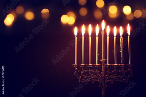 Religion image of jewish holiday Hanukkah background with menorah (traditional candelabra) and candles