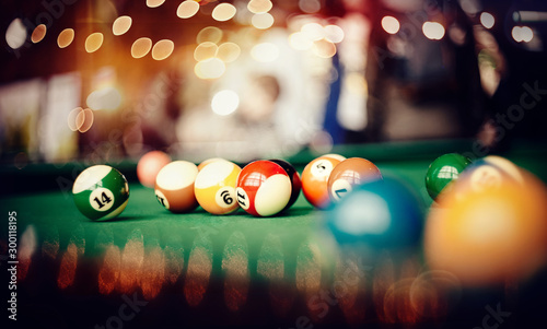 Colorful billiard balls on a billiard table.